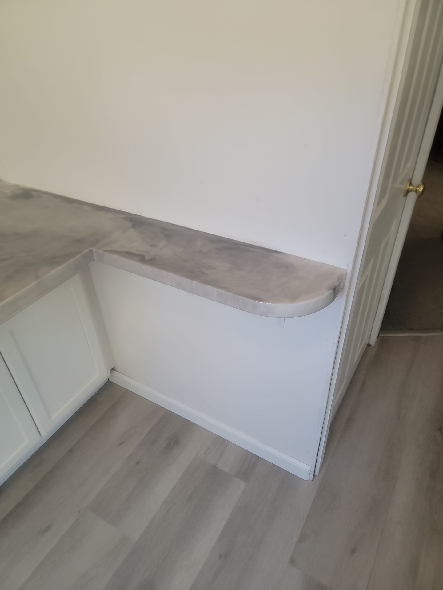 Grey marble epoxy on white cabinets
