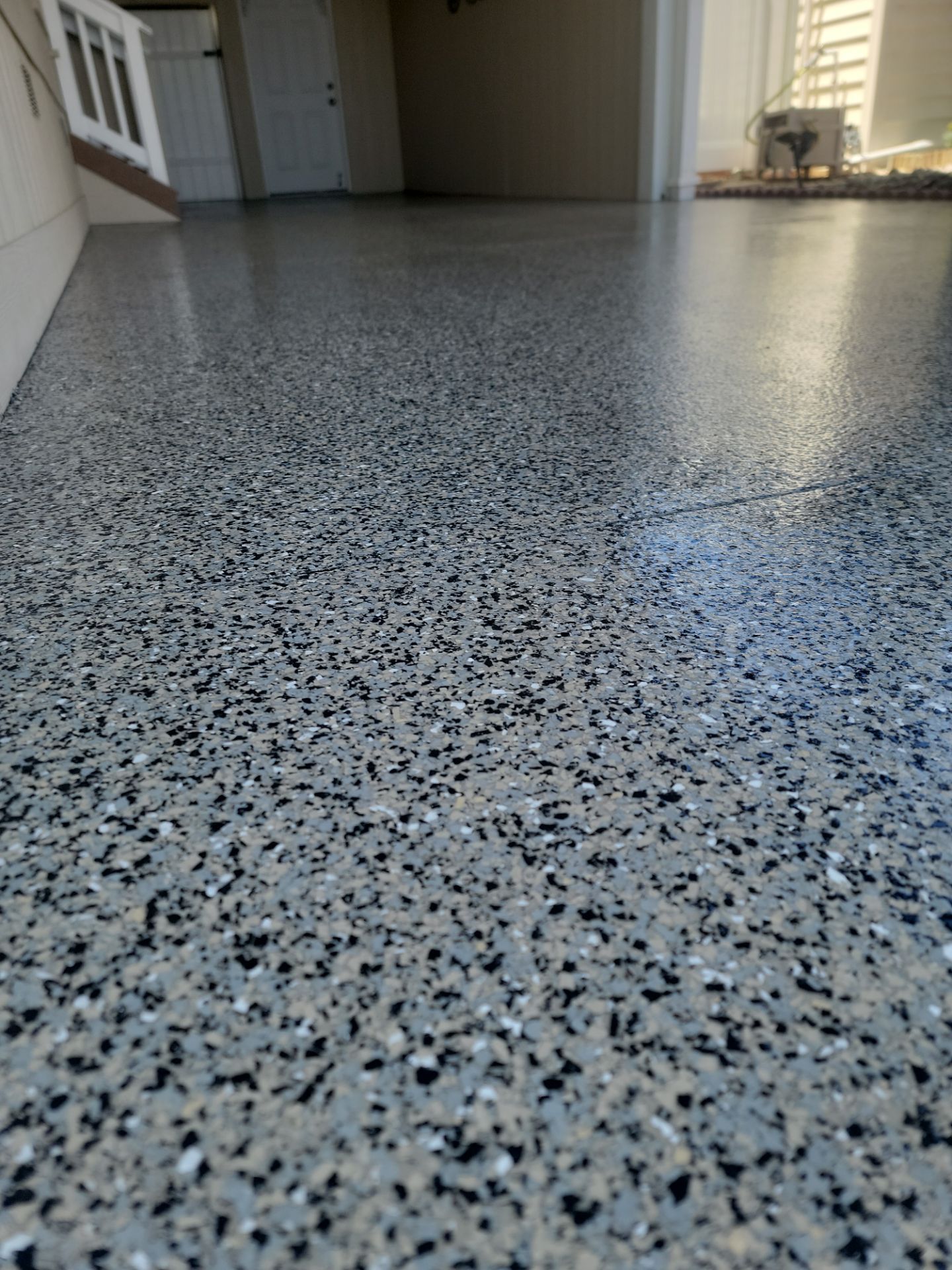 Glossy chip coated carport surface