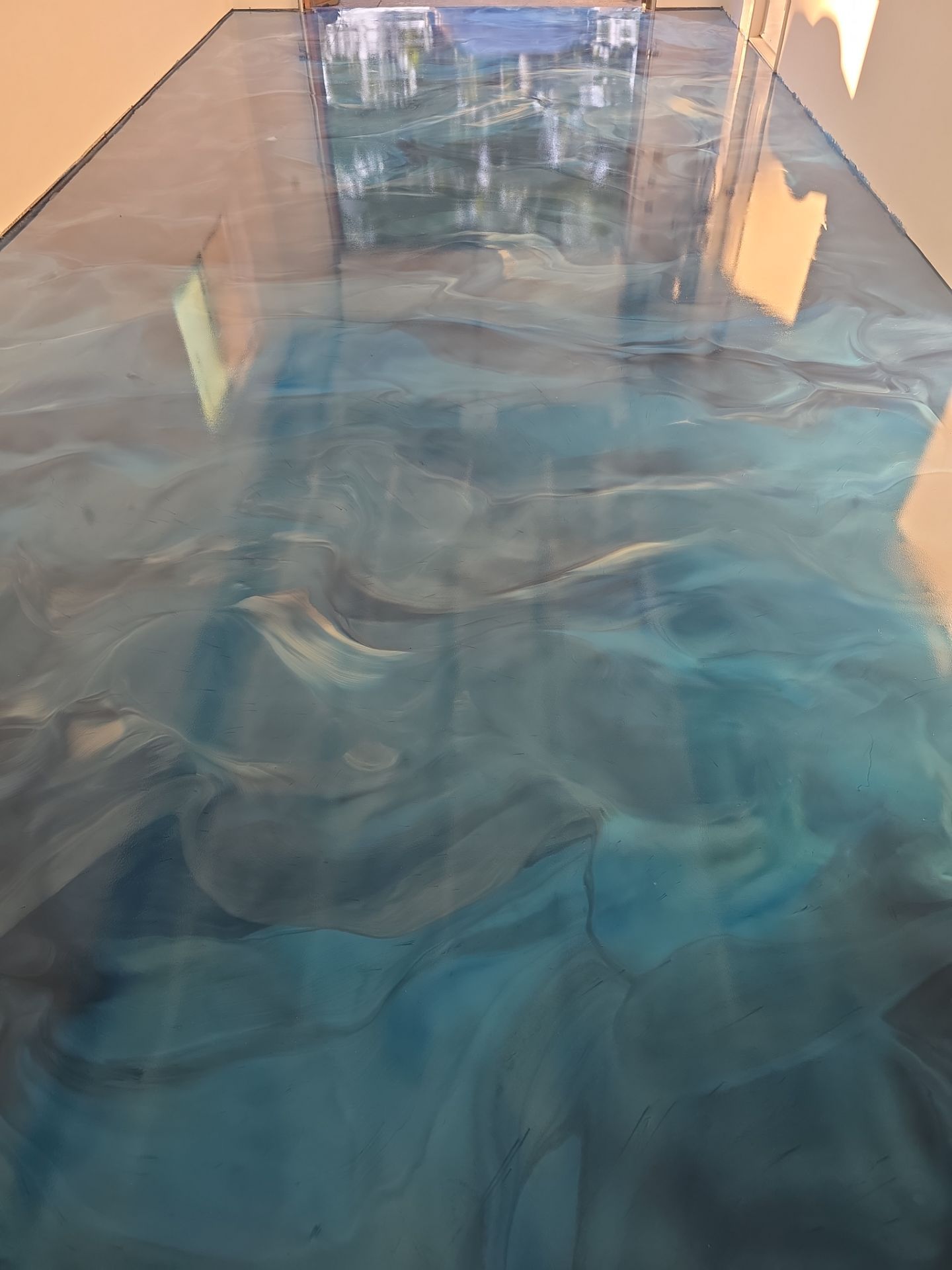 Metallic ocean blue epoxy garage floor